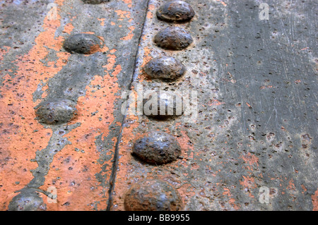 Rivets on rusty metal sheet Stock Photo
