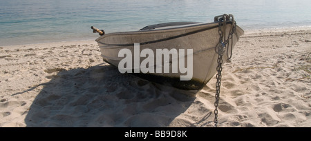 Aluminium dinghy on sandy beach Stock Photo