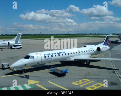 Embraer ERJ-145 regional jet of the company Regional (flying for Air France) on the parking at Lyon Saint Exupery airport Stock Photo