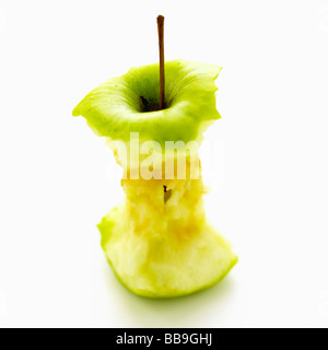 An apple core isolated on a white background, shot with shallow focus to emphasise the strong graphic shape. Stock Photo