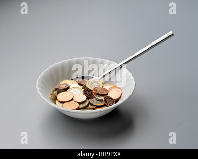 Credit crunch bowl of cereal & money Stock Photo - Alamy