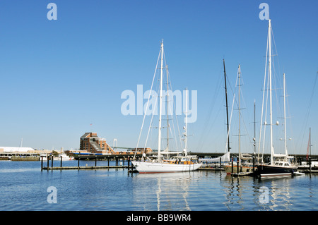 Sailboats docked in 'Newport Harbor Rhode Island' with 'Hyatt Regency hotel' on 'Goat Island' in distance Stock Photo