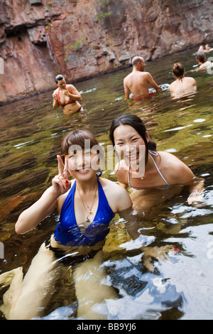 Tourists swimming at Florence Falls in Litchfield National Park, Northern Territory, AUSTRALIA Stock Photo