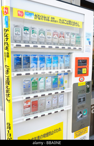 Cigarette vending machine on a street in Ibaraki-shi, a suburb of Osaka. Such vending machines are common throughout Japan. Stock Photo