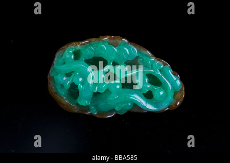Jade Dragon Carving on black background Stock Photo