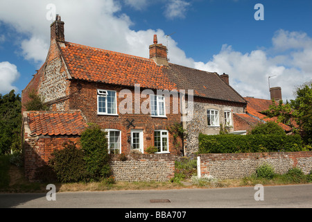 UK England Norfolk Trunch village brick and flint faced houses in Back Street Stock Photo