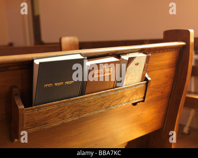 Prayer books on a bench in a Jewish Synagogue Stock Photo