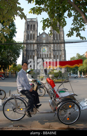 Cyclo drivers waiting, in the back the neo-Gothic St Joseph's Cathedral, Hanoi, Vietnam, Southeast Asia, Asia Stock Photo