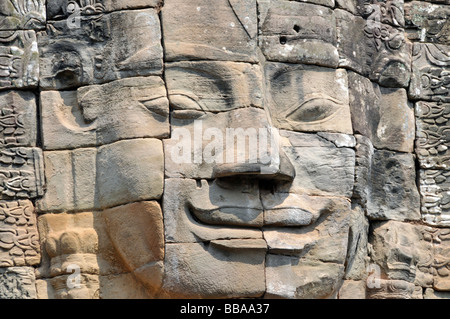 Huge face of the Bodhisattva Lokeshvara chiselled in stone, also called Avalokiteshvara, Bayon Temple, Angkor Thom, UNESCO Worl Stock Photo