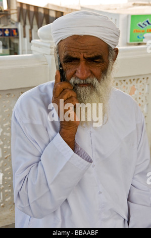 Omani man speaking on his mobile phone Muscat Stock Photo