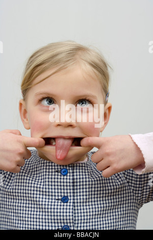 A little girl making a face Stock Photo