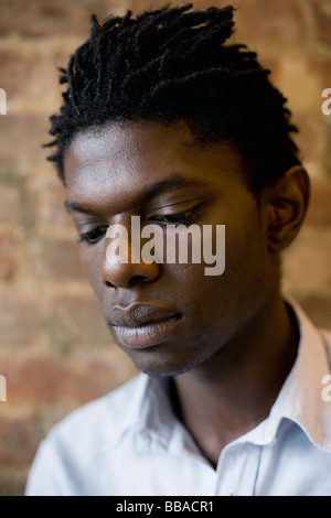 Portrait of a young man looking down Stock Photo