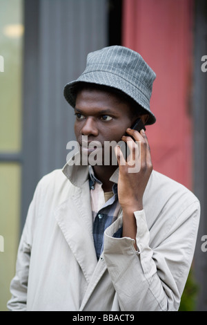 A young man using a mobile phone Stock Photo