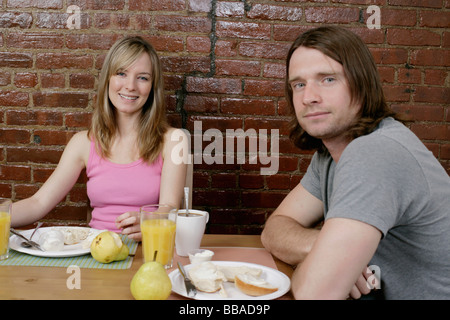 Portrait of a young couple having breakfast together Stock Photo