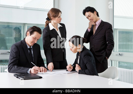 Four business people in a business meeting Stock Photo