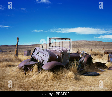 An old abandoned car in a field, Bodie State Historic Park, California, USA Stock Photo