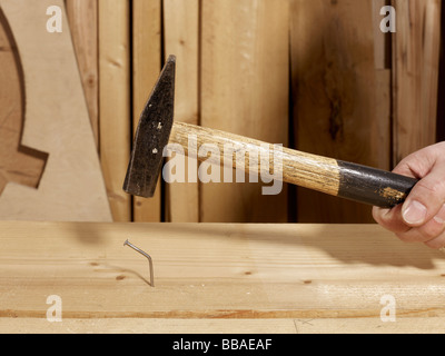 A hammer above a bent nail Stock Photo