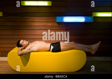 A man lying down in a sauna Stock Photo
