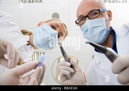 View from below of a dentist and an assistant holding Stock Photo