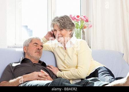 A senior couple on a couch Stock Photo