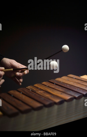 Human hands playing a xylophone Stock Photo