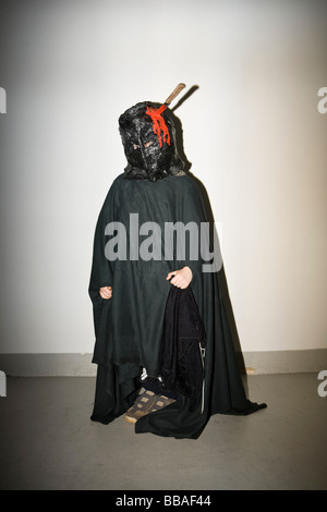 Child dressed in a mask and a cloak Stock Photo