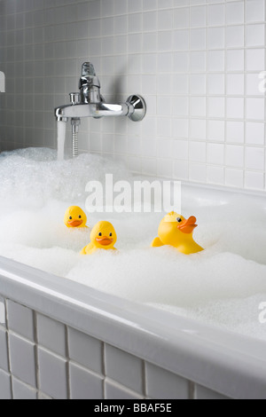 A bubble bath with rubber ducks Stock Photo