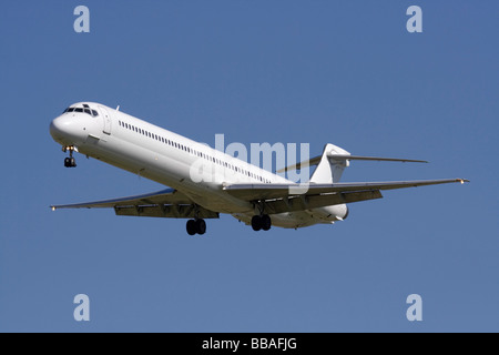 Commercial air travel. Airliner on final approach with no livery and proprietary details deleted Stock Photo