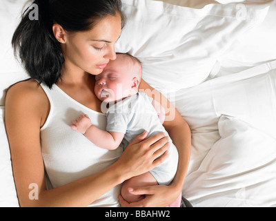 Mother and new-born baby, in bed Stock Photo
