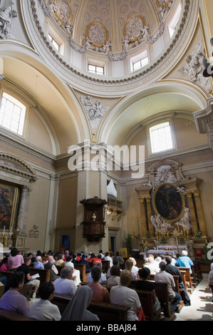 Sunday mass in the church of San Tommaso di Villanova, designed by Bernini, in Castel Gandolfo. Lazio, Italy Stock Photo