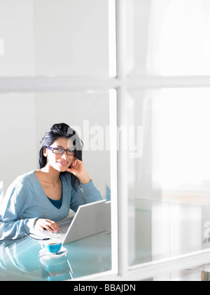 Woman working on computer Stock Photo