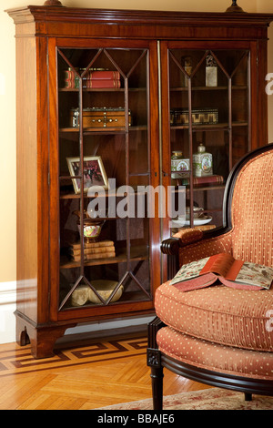 showcase interior bookshelf and easy chair Stock Photo