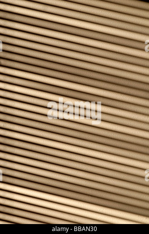 shadow cast from a window and strong sunlight falling on a wall through a venetian blind Stock Photo
