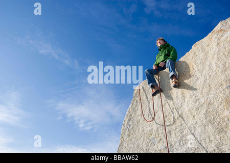 Climber sitting on peak