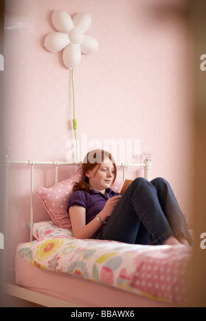 Teenage girl in her room, reading her diary Stock Photo: 10651268 - Alamy