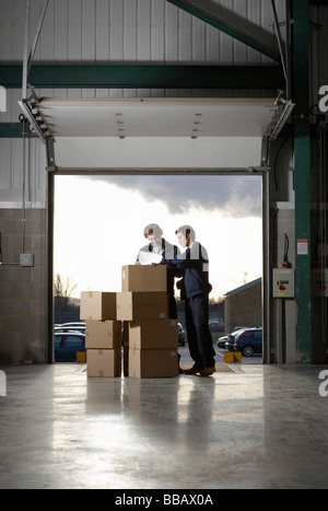 Two workers in warehouse Stock Photo