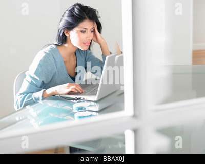 Woman working on computer Stock Photo