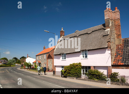 UK England Norfolk Bacton Broomholm village attractive pastel pink painted thatched cottage Stock Photo