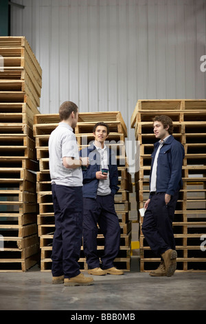 Workers in warehouse having break Stock Photo