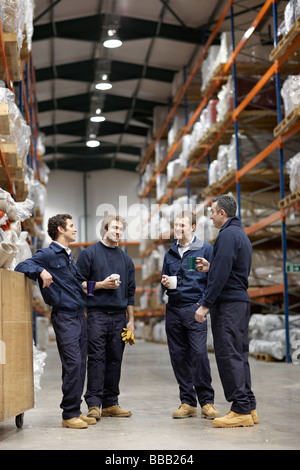 Workers in warehouse having break Stock Photo