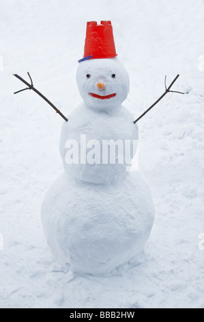 winter snowman with red cap Stock Photo