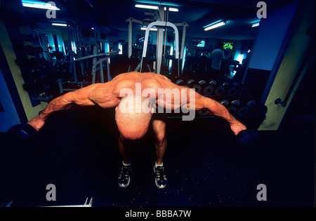 Body builder exercises vigorously Stock Photo