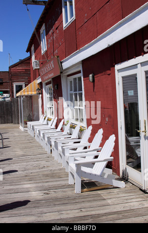 Adirondack chairs outside the Scrimshaw Restaurant, Greenport, Long Island, NY USA Stock Photo