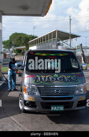 Decorated taxi van at petrol station Nevis Caribbean island Stock Photo