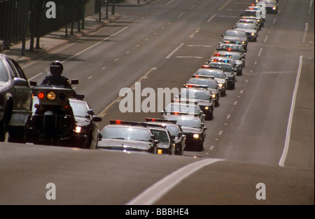 Police funeral procession car motorcycle parade honor tribute law officer death bury Stock Photo