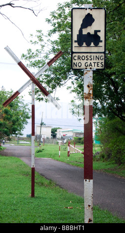 Old fashioned British road sign for railway crossing without gates St Kitts Caribbean Stock Photo