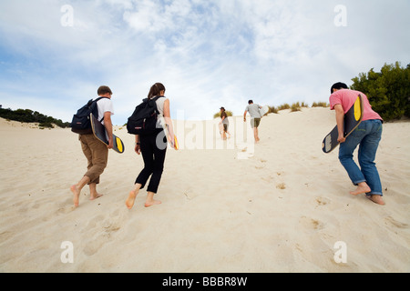 Sandboarders in the sand dunes of Little Sahara.  Kangaroo Island, South Australia, AUSTRALIA Stock Photo