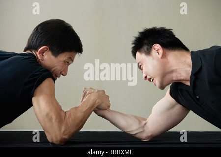 Two men arm wrestling Stock Photo