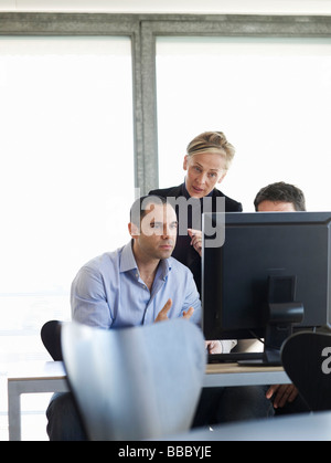 Group of business people at office desk Stock Photo