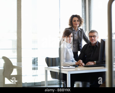 Portrait of business colleges at desk Stock Photo